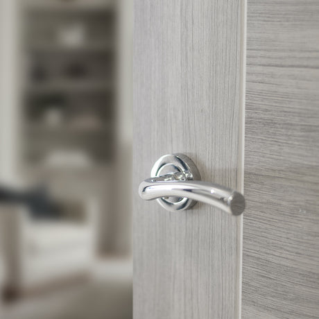 Quality image of STATUS Texas Lever Door Handle on Round Rose - Polished Chrome | Sku. s35rpc | available from Trade Door Handles.