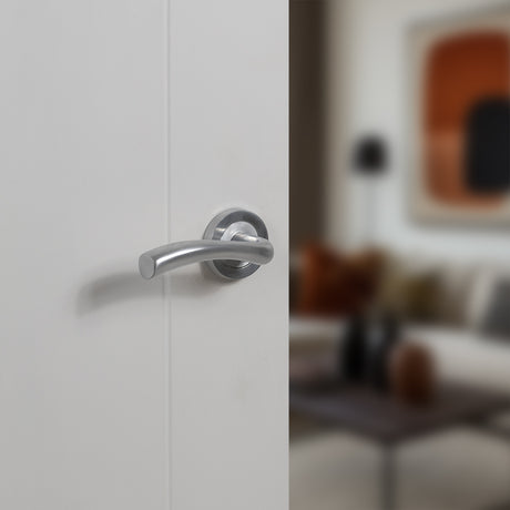 Quality image of STATUS Texas Lever Door Handle on Round Rose - Satin Chrome | Sku. s35rsc | available from Trade Door Handles.