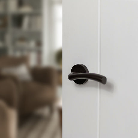 Quality image of STATUS Texas Lever Door Handle on Round Rose - Urban Dark Bronze | Sku. s35rudb | available from Trade Door Handles.