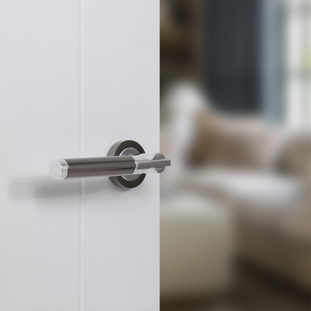 Quality image of STATUS Dakota Lever Door Handle on Round Rose - Black Nickel/Polished Chrome | Sku. s36rbnpc | available from Trade Door Handles.