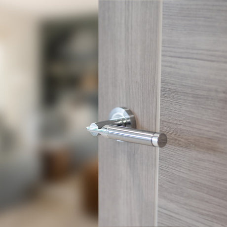 Quality image of STATUS Dakota Lever Door Handle on Round Rose - Satin Chrome/Polished Chrome | Sku. s36rscpc | available from Trade Door Handles.