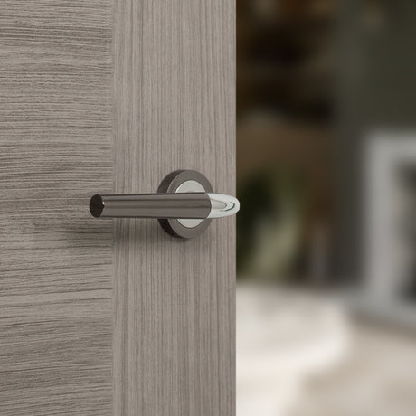 Quality image of STATUS Tennessee Lever Door Handle on Round Rose - Black Nickel/Polished Chrome | Sku. s37rbnpc | available from Trade Door Handles.