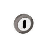 Quality image of STATUS Key Escutcheons on Round Rose - Black Nickel/Polished Chrome | Sku. s3esckrbnpc | available from Trade Door Handles.