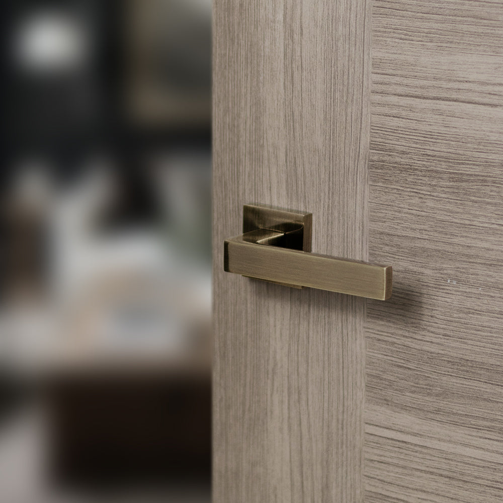 Quality image of STATUS Montana Lever Door Handle on S4 Square Rose - Antique Brass | Sku. s40sab | available from Trade Door Handles.