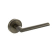 Quality image of STATUS Alabama Lever Door Handle on Round Rose - Antique Brass | Sku. s43rab | available from Trade Door Handles.