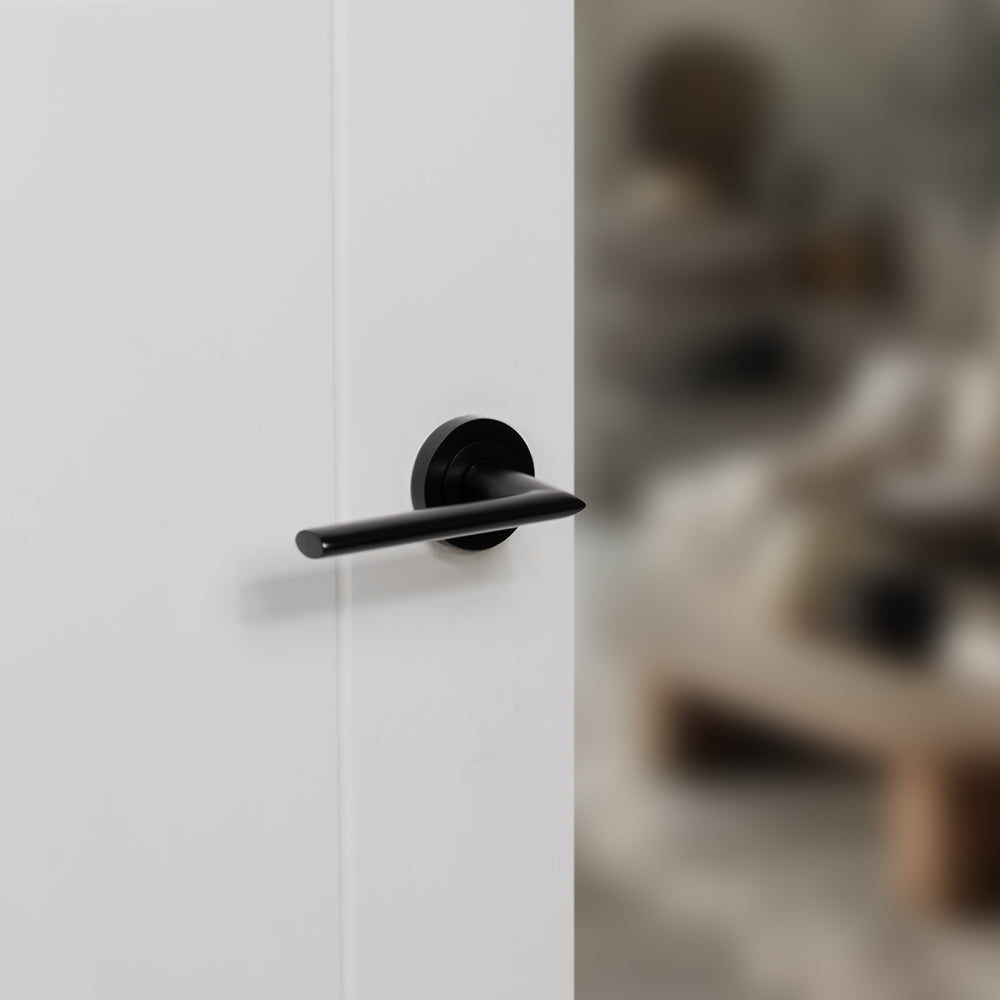Quality image of STATUS Alabama Lever Door Handle on Round Rose - Matt Black | Sku. s43rmb | available from Trade Door Handles.