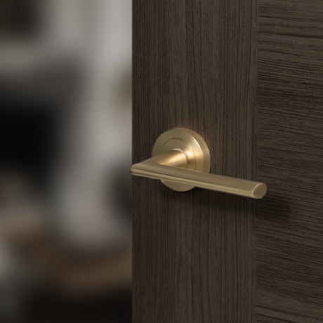 Quality image of STATUS Alabama Lever Door Handle on Round Rose - Satin Brass | Sku. s43rsb | available from Trade Door Handles.