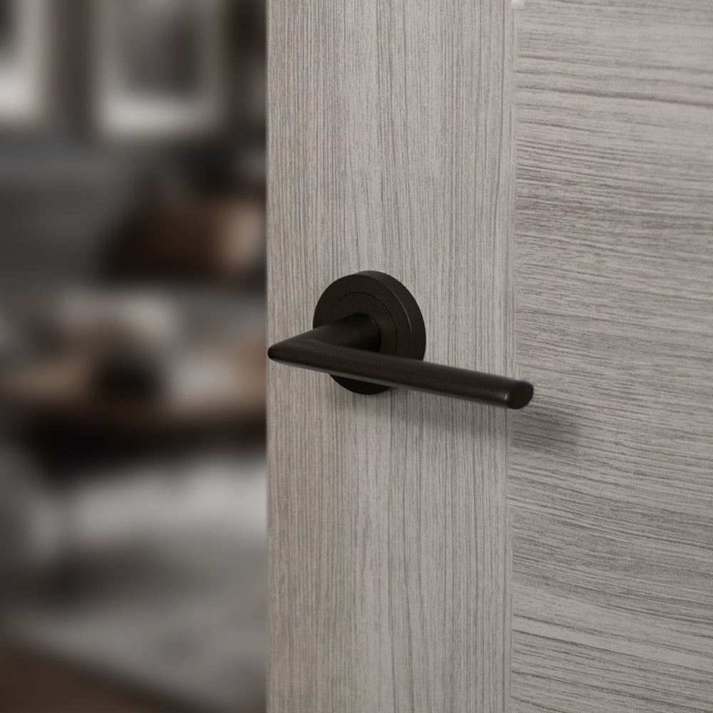 Quality image of STATUS Alabama Lever Door Handle on Round Rose - Urban Dark Bronze | Sku. s43rudb | available from Trade Door Handles.