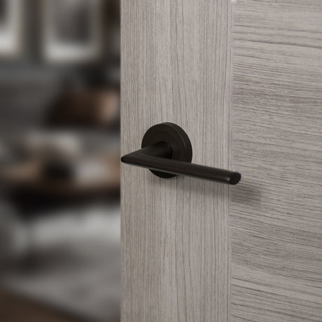 Quality image of STATUS Alabama Lever Door Handle on Round Rose - Urban Dark Bronze | Sku. s43rudb | available from Trade Door Handles.