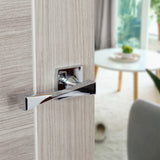Quality image of Senza Pari Guido Lever Door Handle on Flush Square Rose - Polished Chrome | Sku. sp190cp | available from Trade Door Handles.