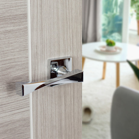 Quality image of Senza Pari Guido Lever Door Handle on Flush Square Rose - Polished Chrome | Sku. sp190cp | available from Trade Door Handles.