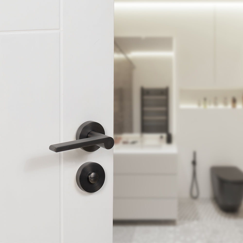 Quality image of Senza Pari WC Turn and Release on Minimal Round Rose - Urban Dark Bronze | Sku. sprwcudb | available from Trade Door Handles.