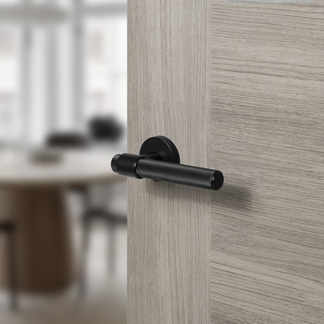 Quality image of Senza Pari Andretta Knurled Lever Door Handle on Minimal Round Rose - Matt Black | Sku. spr160mb | available from Trade Door Handles.