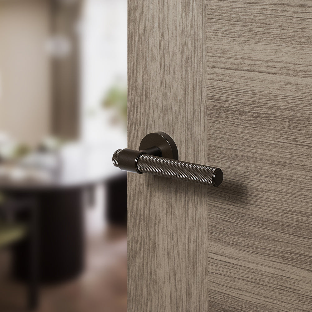 Quality image of Senza Pari Andretta Knurled Lever Door Handle on Minimal Round Rose - Urban Dark Bronze | Sku. spr160udb | available from Trade Door Handles.