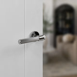 Quality image of Senza Pari Fasana Linear Knurled Lever Door Handle on Minimal Round Rose - Polished Chrome | Sku. spr165pc | available from Trade Door Handles.