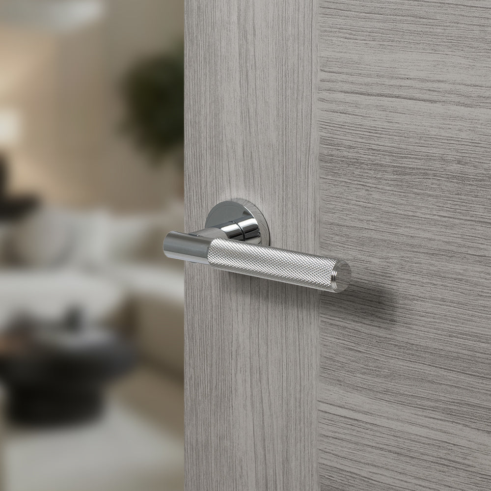 Quality image of Senza Pari Rosarno Knurled Lever Door Handle on Minimal Round Rose - Polished Chrome | Sku. spr170pc | available from Trade Door Handles.