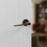 Quality image of Senza Pari Laviano Lever Door Handle on Minimal Round Rose - Urban Dark Bronze | Sku. spr180udb | available from Trade Door Handles.