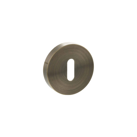 Quality image of Senza Pari Key Escutcheons on Minimal Round Rose - Antique Brass | Sku. spresckab | available from Trade Door Handles.