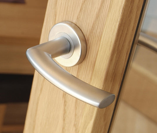 Image showing a Door Handle on a round rose in satin chrome SZC020SC by Carlisle Brass, available to order from Trade Door Handles in Kendal