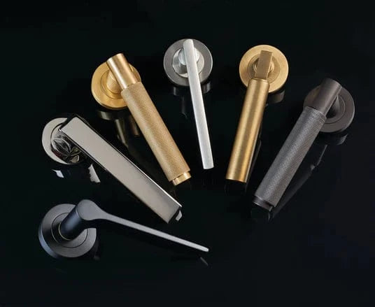 Selection Carlisle Brass Door Handles on Round Roses