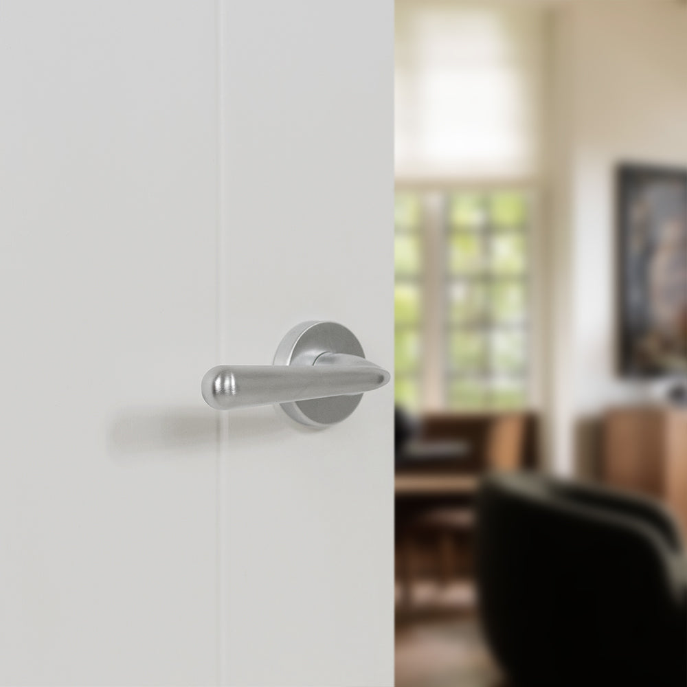 Quality image of Tupai Rapido CurvaLine Adra Lever Door Handle on Round Rose - Satin Chrome | Sku. t293rsc | available from Trade Door Handles.