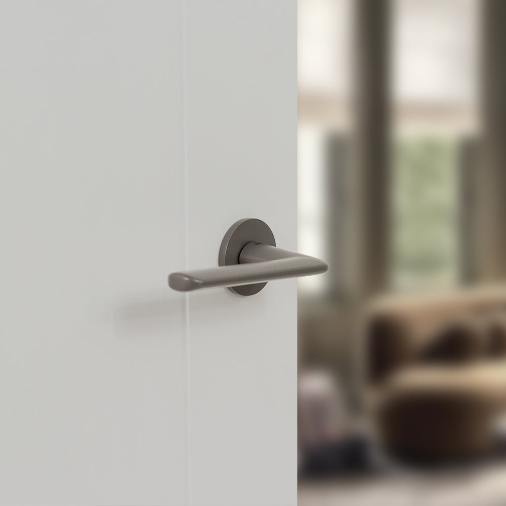 Quality image of Tupai Rapido 5S Line Tavira Lever Door Handle on 5mm Slimline Round Rose - Titanium | Sku. t3098r5stt | available from Trade Door Handles.