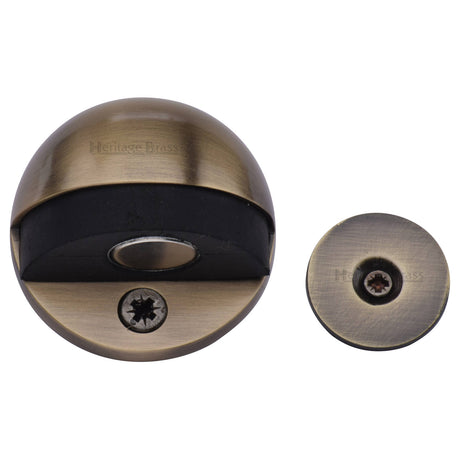 High quality image of the Heritage Brass Round Shielded Floor Mounted Magnetic Door Stop Antique Brass Finish
 | Sku. v1080-mag-at | Discounted prices available from Trade Door Handles