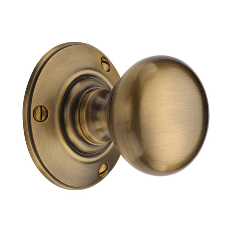 High quality image of Heritage Brass Mortice Knob on Rose Chester Design Antique Brass finish | Sku. v876-at | available to order from Trade Door Handles in Kendal.