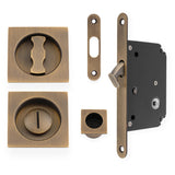 High quality image of Alexander & Wilks - Sliding Door Lock Set - Square Roses - Radius Forend & Strike-Antique Brass | Sku. aw111rab | Trade Door Handles.