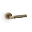 High quality image of Alexander & Wilks - Hurricane Reeded Lever on Round Rose - Antique Brass | Sku. aw202ab | Trade Door Handles.