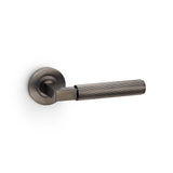 High quality image of Alexander & Wilks - Hurricane Reeded Lever on Round Rose - Dark Bronze PVD | Sku. aw202dbzpvd | Trade Door Handles.