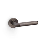 High quality image of Alexander & Wilks - Harrier Knurled Lever on Round Rose - Dark Bronze PVD | Sku. aw210dbzpvd | Trade Door Handles.