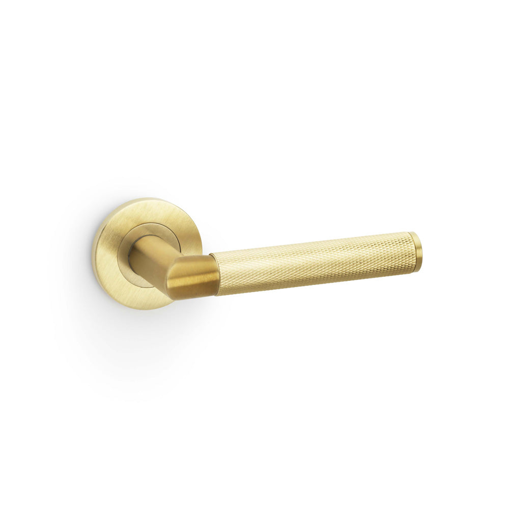 High quality image of Alexander & Wilks - Harrier Knurled Lever on Round Rose - Satin Brass PVD | Sku. aw210sbpvd | Trade Door Handles.