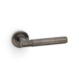 High quality image of Alexander & Wilks - Spitfire Knurled Lever on Round Rose - Dark Bronze PVD | Sku. aw220dbzpvd | Trade Door Handles.