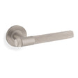 This is an image of Alexander & Wilks - Knurled Kingstone Lever on Round Rose - Satin Nickel PVD available to order from Trade Door Handles in Kendal, quick delivery and discounted prices.