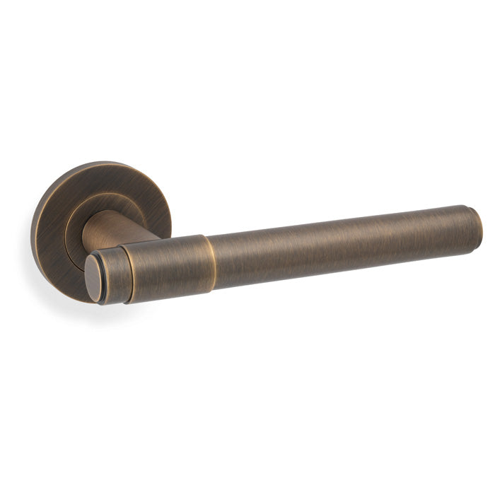 High quality image of Alexander & Wilks - Kingston Plain Lever on Round Rose-Antique Brass | Sku.AW241AB | Trade Door Handles.