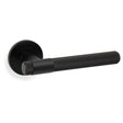 High quality image of Alexander & Wilks - Kingston Reeded lever on Round Rose-Black | Sku.AW242BL | Trade Door Handles.