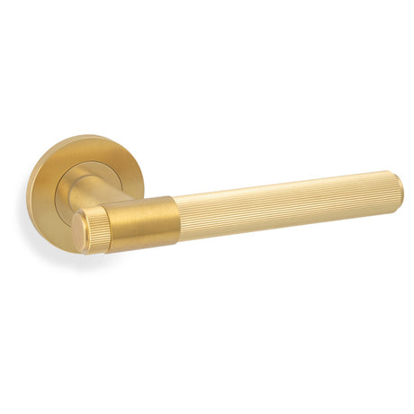 High quality image of Alexander & Wilks - Kingston Reeded lever on Round Rose-Satin Brass PVD | Sku.AW242SBPVD | Trade Door Handles.