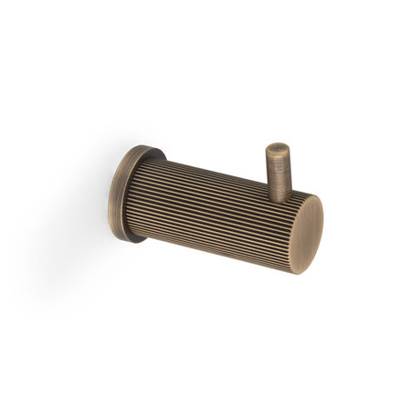 This is an image of Alexander & Wilks - BRUNEL REEDED COAT HOOK ON 25MM ROSE - Antique Brass available to order from Trade Door Handles in Kendal, quick delivery and discounted prices.