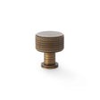 High quality image of Alexander & Wilks Lucia Knurled Cupboard Knob - Antique Brass - 29mm | Sku. aw807k-29-ab | Trade Door Handles.