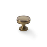 High quality image of Alexander & Wilks Lynd Cupboard Knob - Antique Brass - 32mm | Sku. aw808-32-ab | Trade Door Handles.