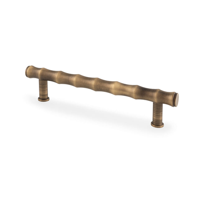 High quality image of Alexander & Wilks Crispin Bamboo T-bar Cupboard Pull Handle - Antique Brass - 128mm Centres | Sku. aw809b-128-ab | Trade Door Handles.