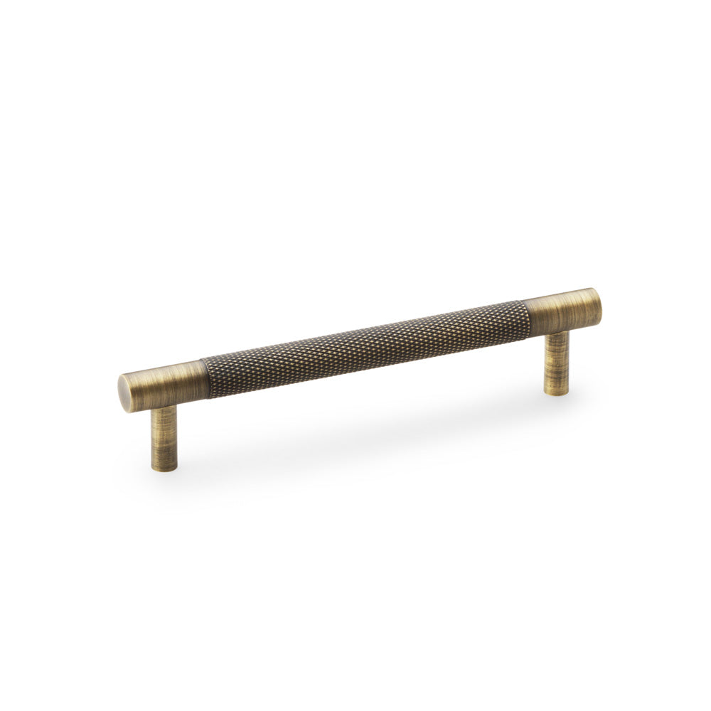 High quality image of Alexander & Wilks Brunel Knurled T-Bar Cupboard Handle - Antique Brass - Centres 128mm | Sku. aw810-128-ab | Trade Door Handles.