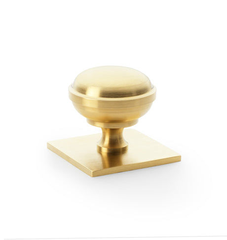 High quality image of Alexander & Wilks Quantock Cupboard Knob on Square Backplate - Satin Brass PVD - 38mm | Sku. aw826-38-sbpvd | Trade Door Handles.