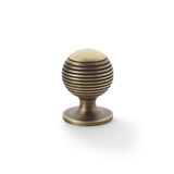 High quality image of Alexander & Wilks Caesar Cupboard Knob on Round Rose - Antique Brass - 32mm | Sku. aw832-32-ab | Trade Door Handles.