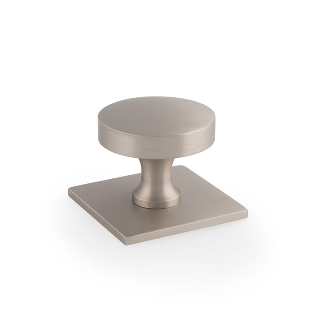 This is an image of Alexander & Wilks - Bullion Cupboard Knob on Square Backplate-Satin Nickel available to order from Trade Door Handles in Kendal, quick delivery and discounted prices.