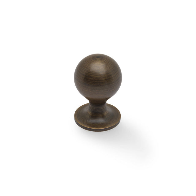 High quality image of Alexander & Wilks Plain Caesar Cabinet Knob-Antique Brass-25mm | Sku. AW844-25-AB | Trade Door Handles.