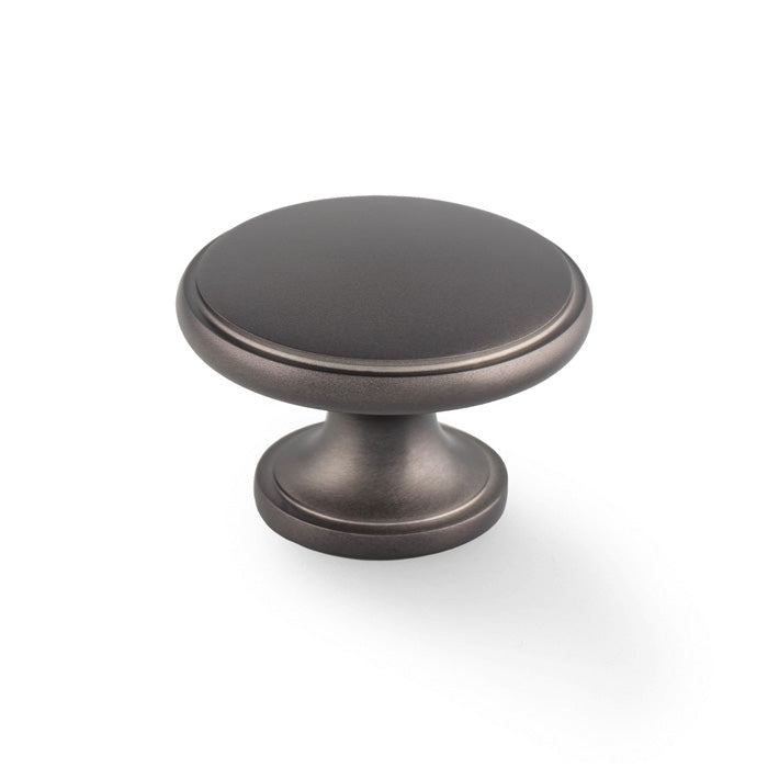 This is an image of Alexander & Wilks - Cambridge Round Cupboard Knob - Dark Bronze available to order from Trade Door Handles in Kendal, quick delivery and discounted prices.