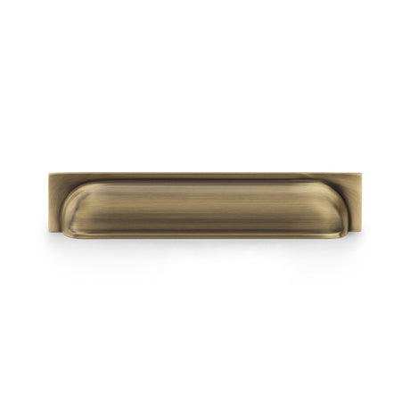 High quality image of Alexander & Wilks Quantock Cup Pull Handle - Antique Brass - Centres 203mm | Sku. aw906ab | Trade Door Handles.