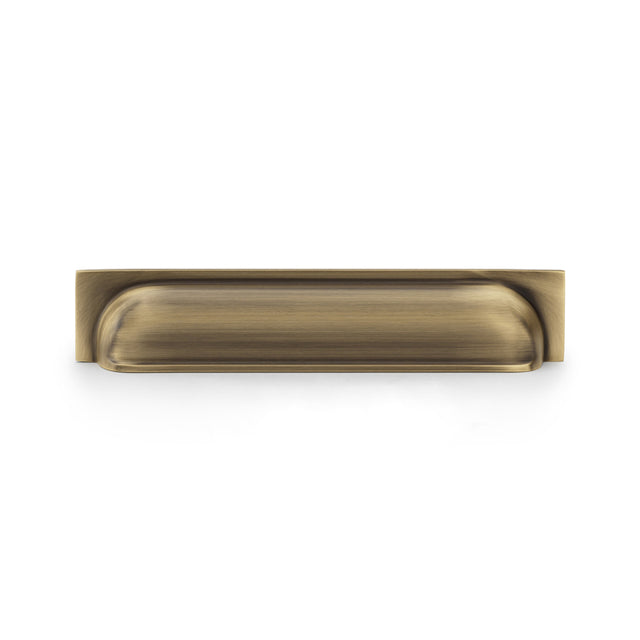 High quality image of Alexander & Wilks Quantock Cup Pull Handle - Antique Brass - Centres 203mm | Sku. aw906ab | Trade Door Handles.